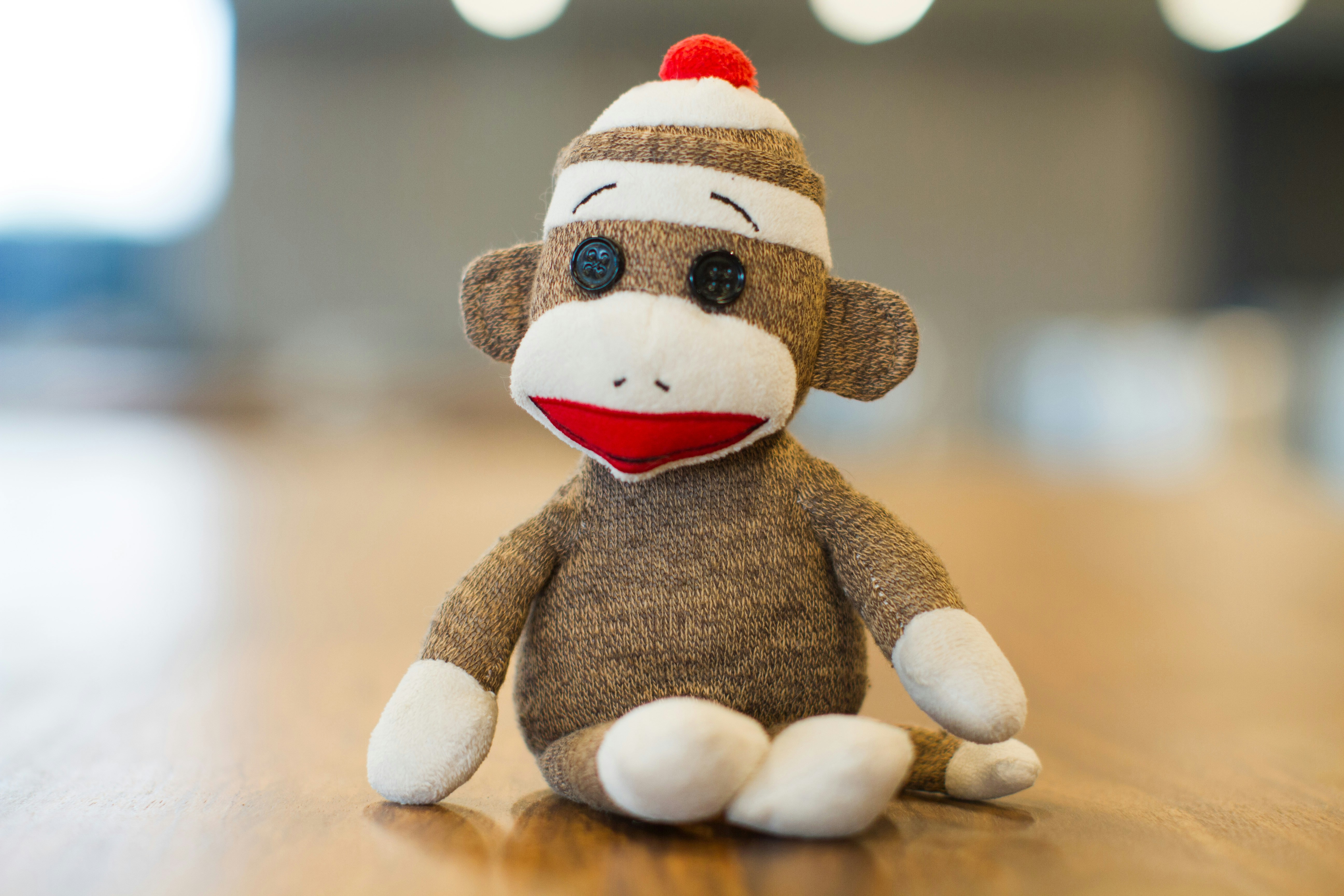Image of a sock monkey sitting on a table